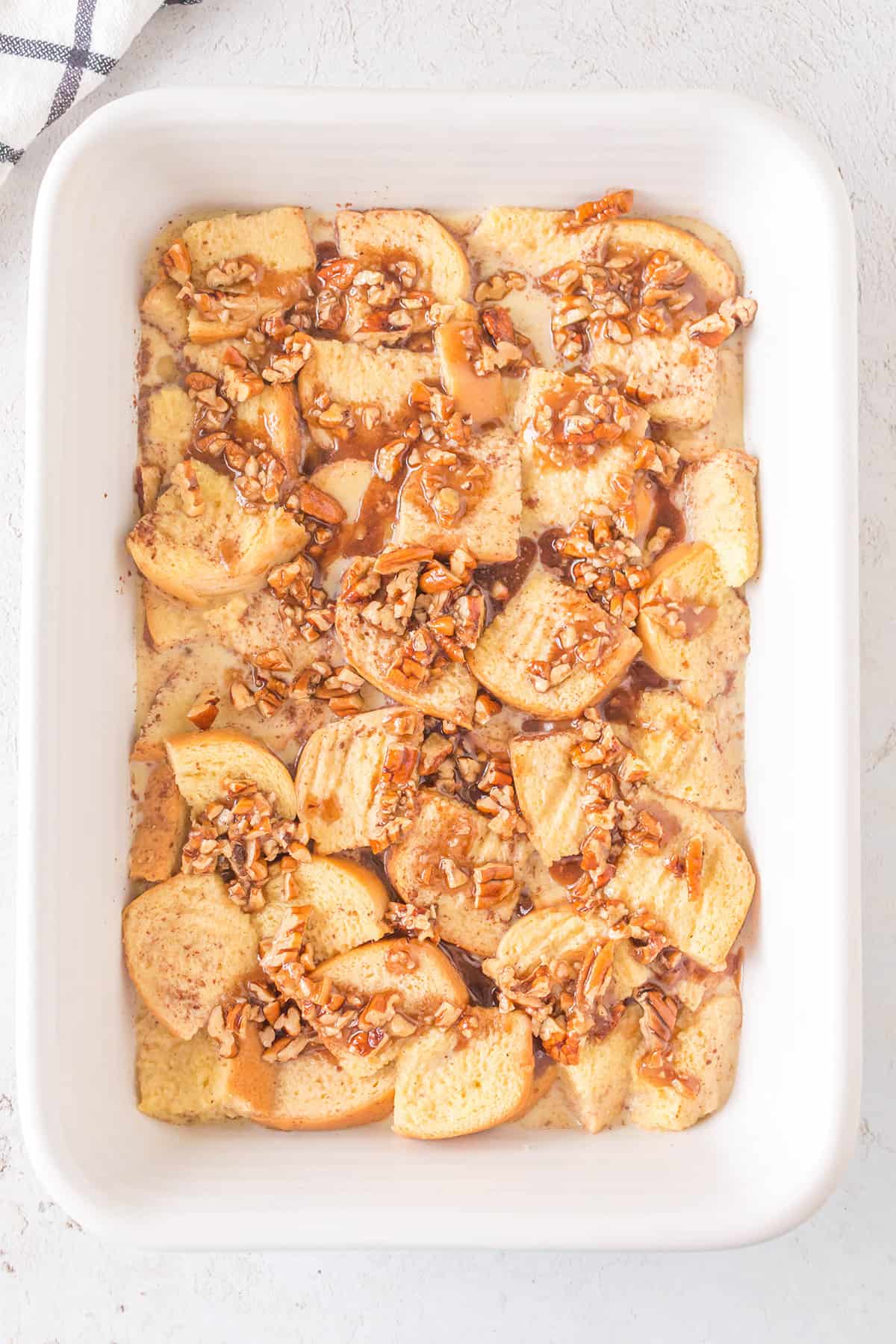 Pecan topping added to baking dish.