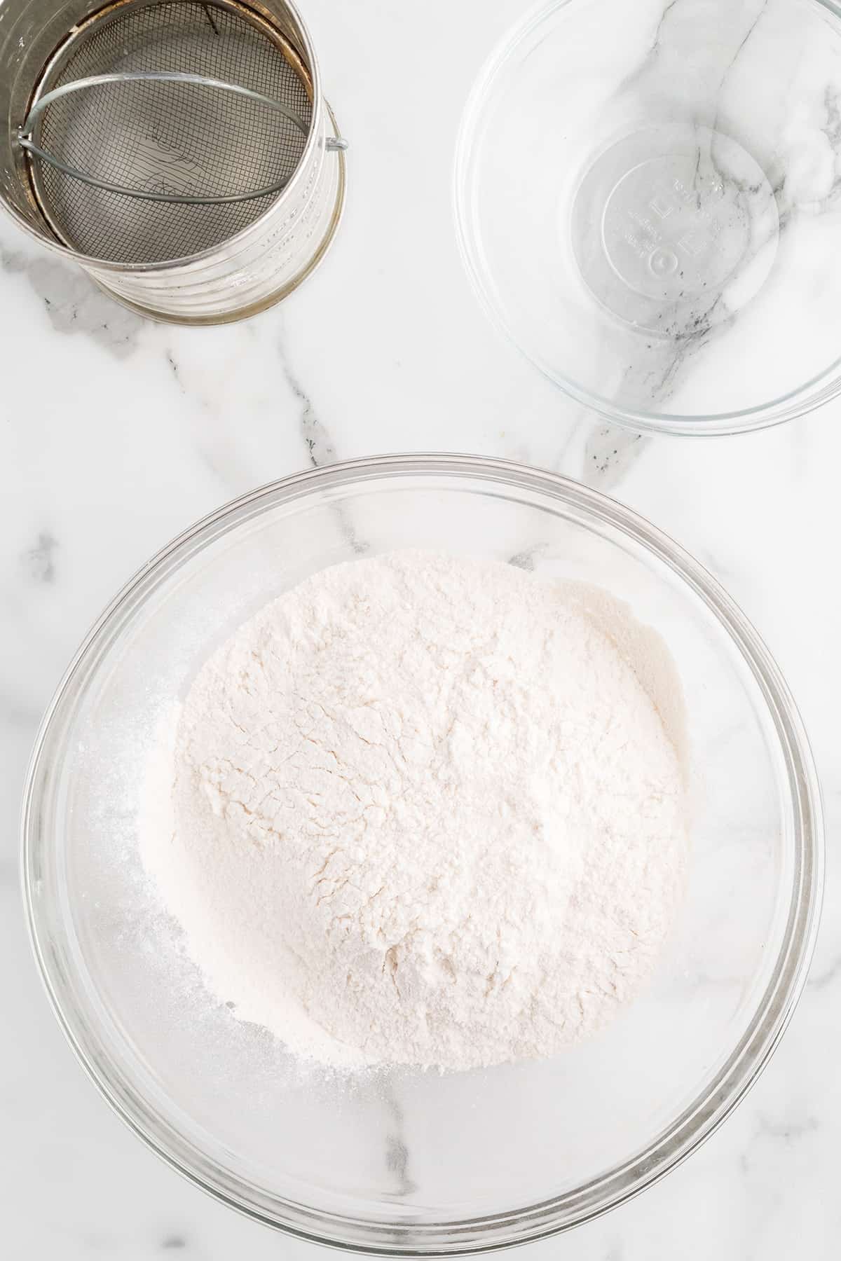 Sugar and flour sifted together in a bowl.