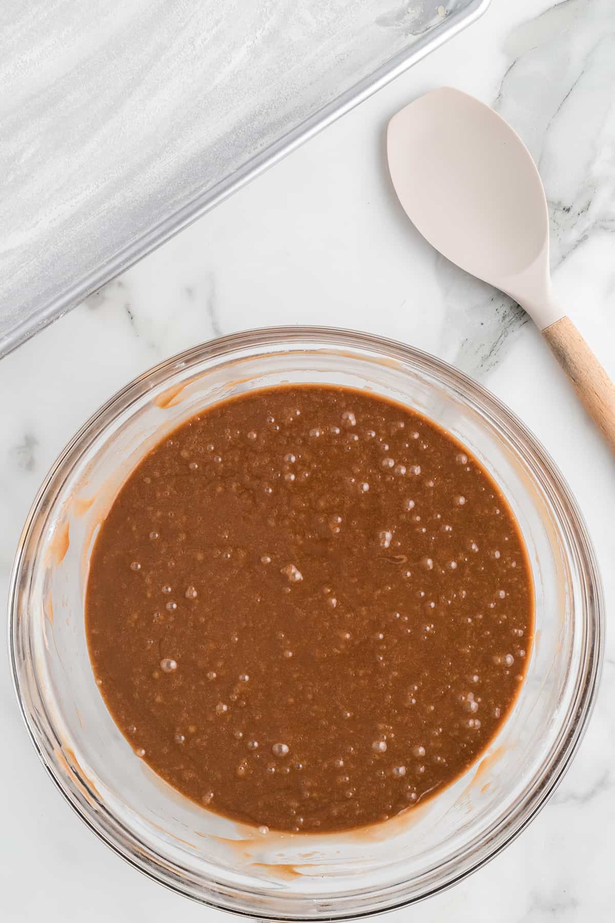 Cake batter thoroughly mixed in a bowl.