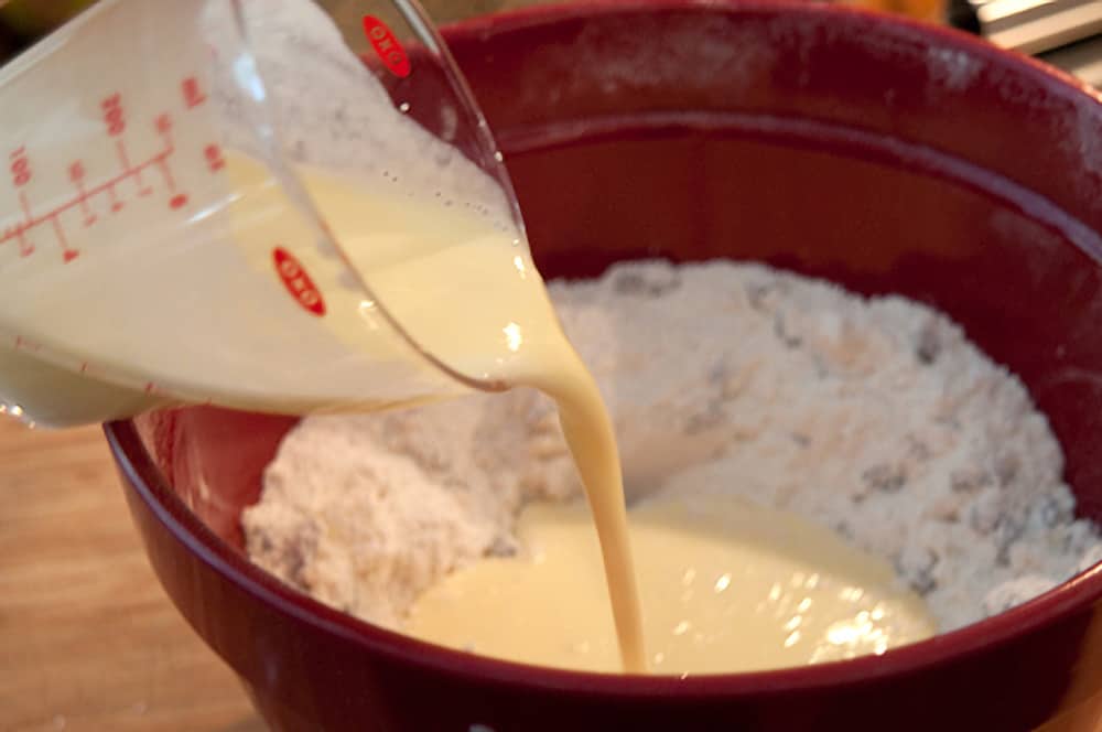 Adding buttermilk and egg to the flour mixture.