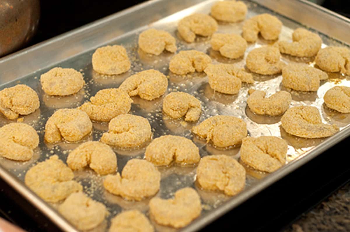 Coated shrimp on baking pan ready for the oven.