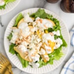 Pear and blue cheese salad on a white serving plate.