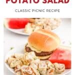 Two plates with potato salad, burgers, and watermelon slices, labeled Southern Potato Salad: Classic Picnic Recipe.
