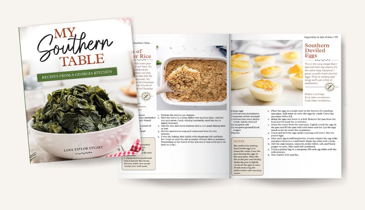 Open cookbook titled My Southern Table with pages showing recipes and photos of food, including deviled eggs.