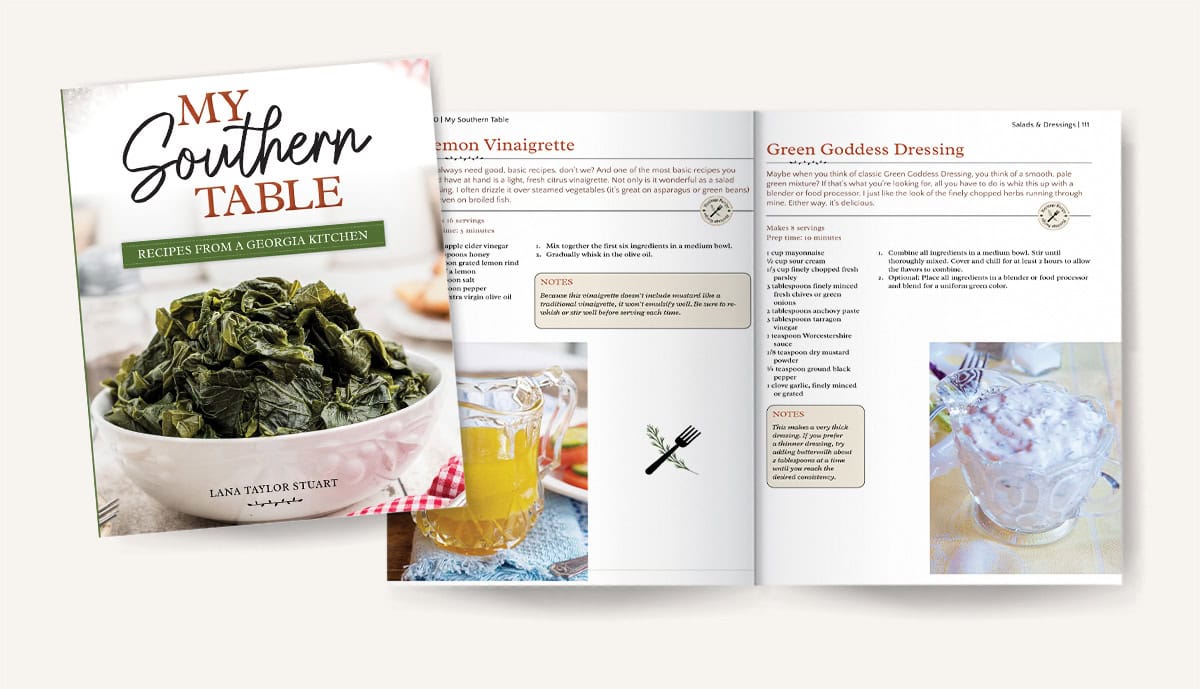 A cookbook titled My Southern Table with its cover showing cooked greens, next to an open spread displaying recipes for Lemon Vinaigrette and Green Goddess Dressing.