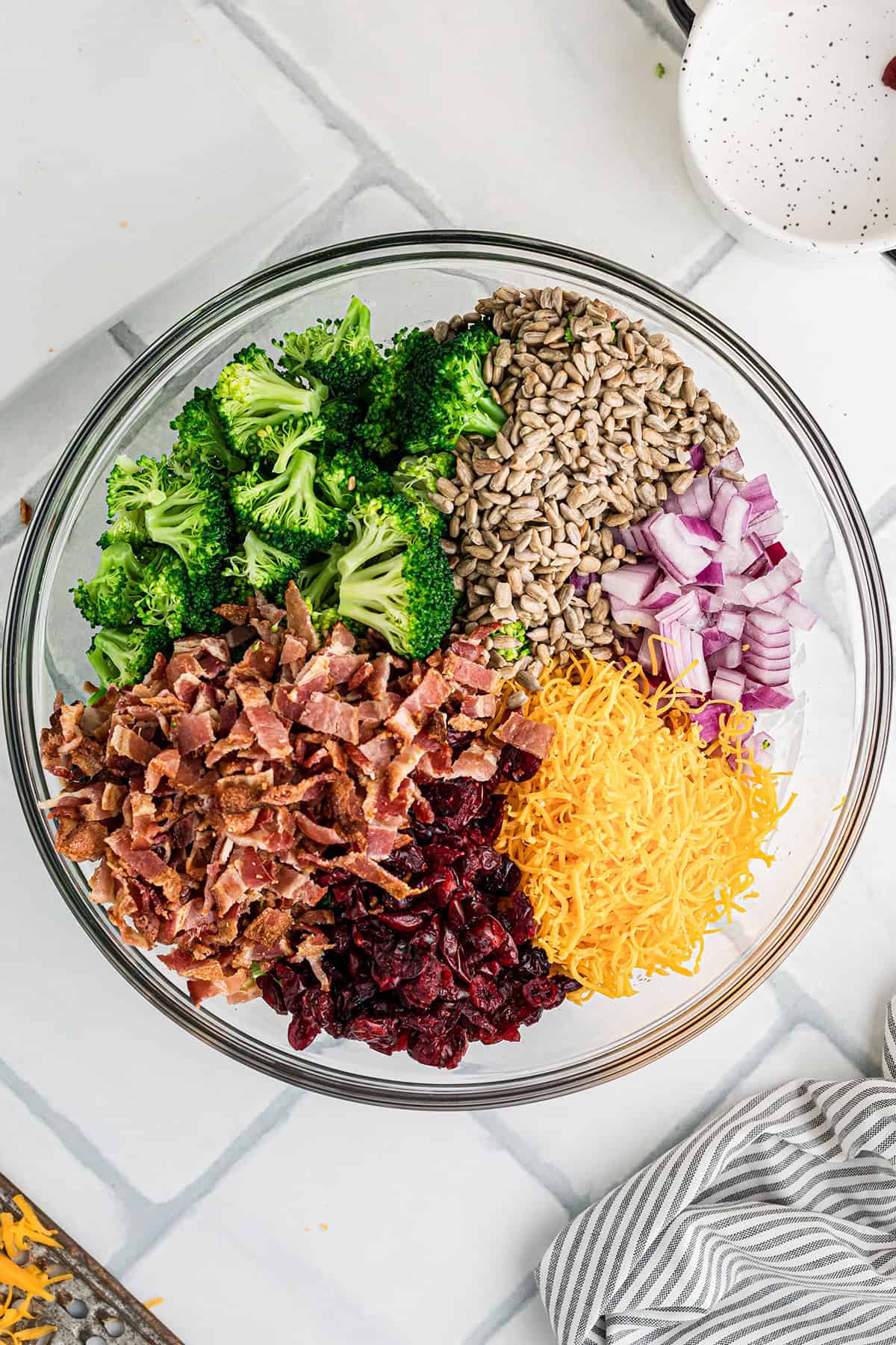 Remaining salad ingredients added to the mixing bowl.