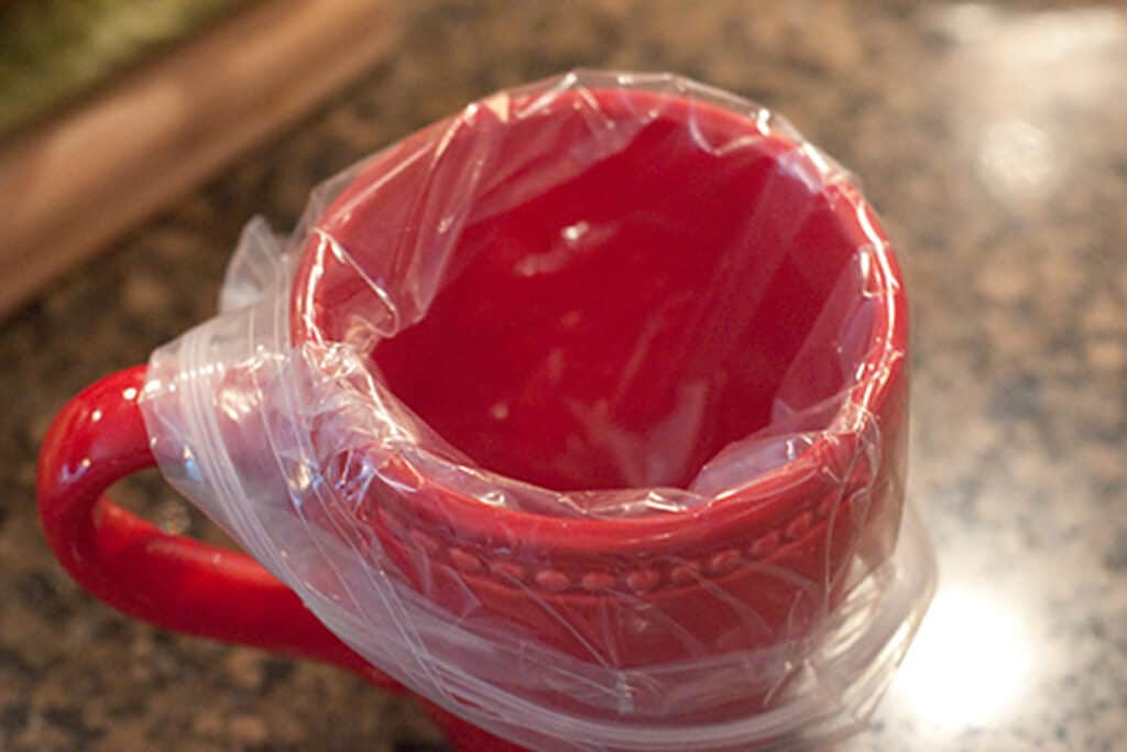 Ziploc bag in a cup.