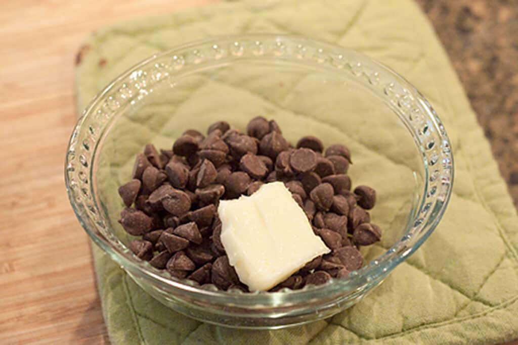 Chocolate chips and butter in a small bowl.