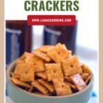 A bowl filled with spicy cheese crackers, with text Spicy Cheese Crackers above.