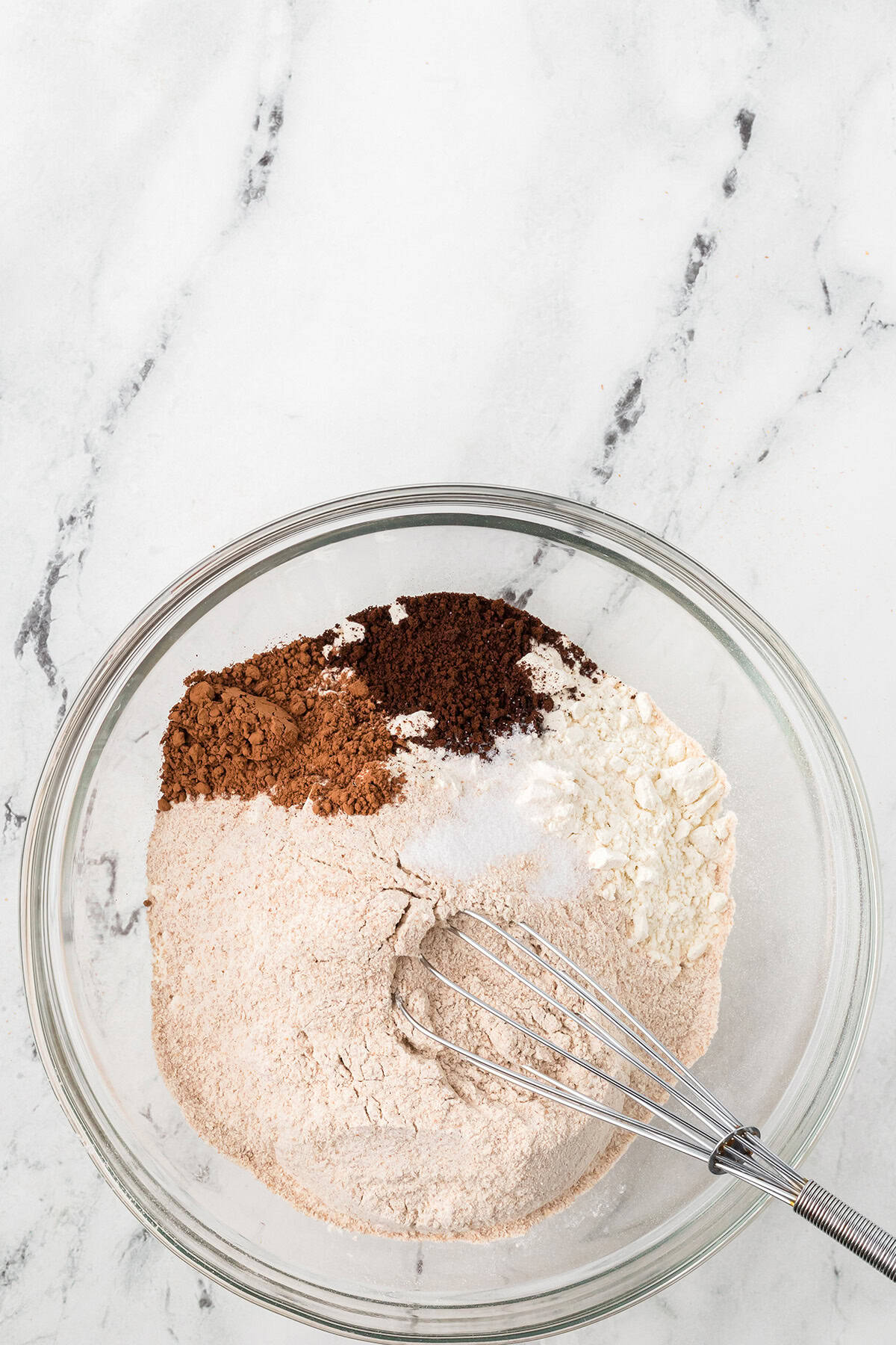 Flours, cocoa, coffee, and salt in a mixing bowl.