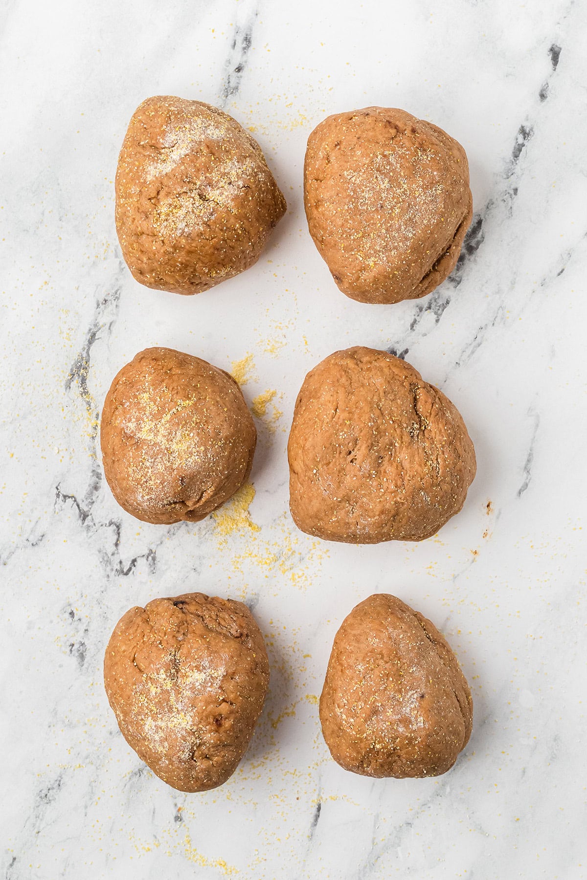 Dough portions formed into mini loaves.