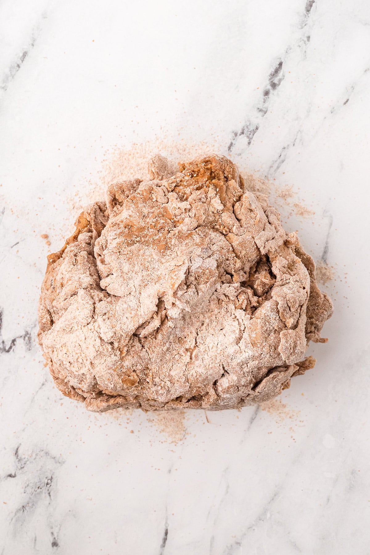 Rough dough on a floured surface.