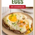 Two eggs and cheese on toasted bread, topped with chives, served on a plate with Alpine Eggs text above.