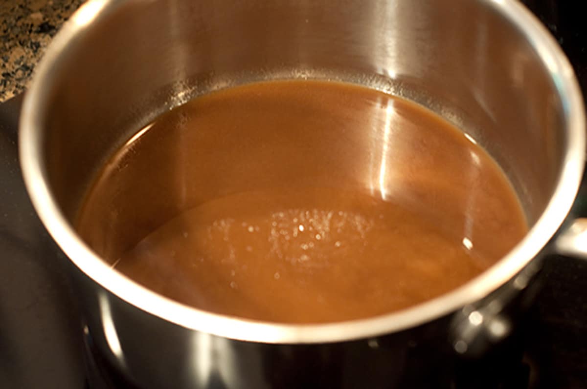 Marinade being cooked down to a sauce.