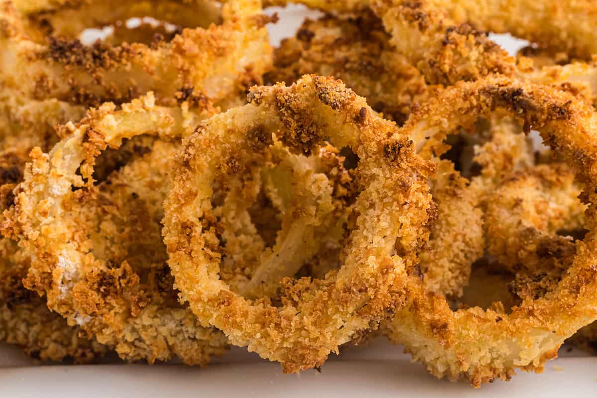 A mound of finished baked panko onion rings.