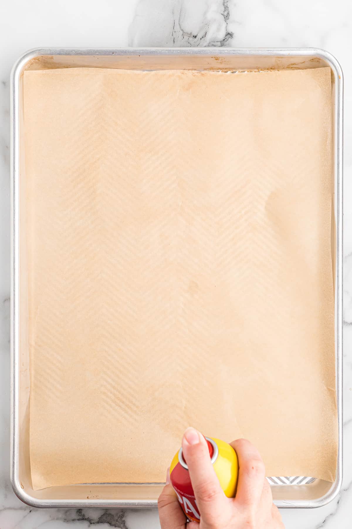 A parchment paper lined baking sheet.