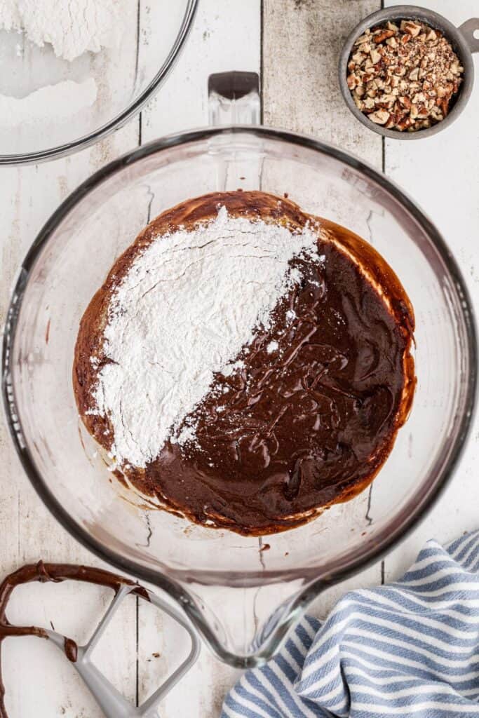 Sifted flour on top of the melted chocolate mixture before being mixed together.