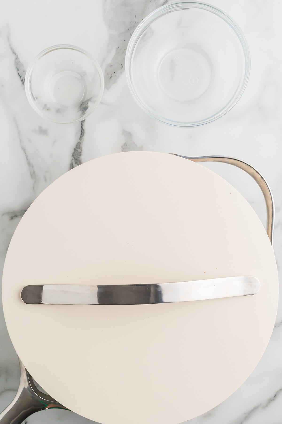 Skillet covered with a lid to faciliate shaking and mixing the contents.
