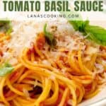 A close-up of spaghetti topped with tomato basil sauce, garnished with grated cheese and fresh basil leaves. Text over the image reads Easy Recipe Tomato Basil Sauce and lanascooking.com.