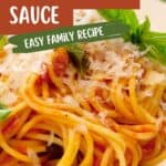 A plate of spaghetti topped with tomato basil sauce, grated cheese, and fresh basil leaves. Text on the image reads Pasta with Tomato Basil Sauce, Easy Family Recipe, www.lanascooking.com.