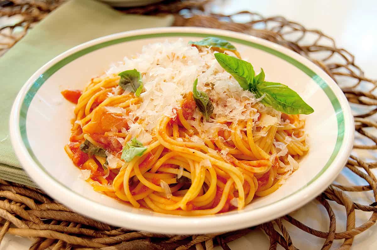 A serving of pasta with tomato basil sauce.