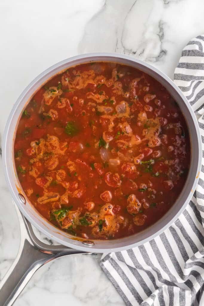 Soup simmering in a saucepan.