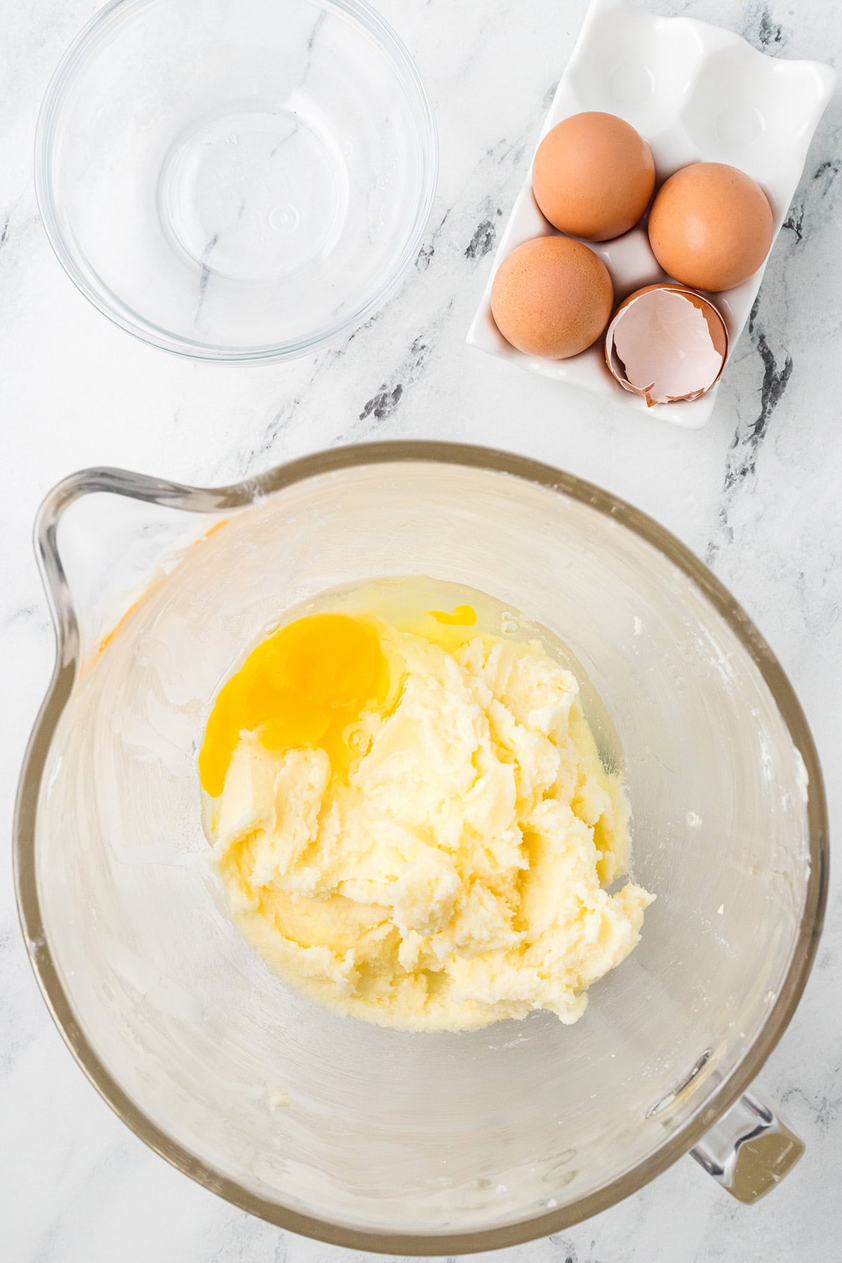 Eggs being added to the creamed butter and sugar.