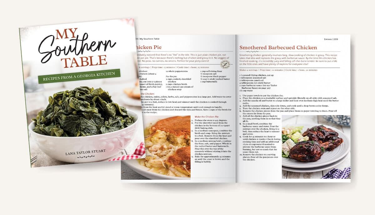 A cookbook titled My Southern Table with open pages showing recipes and food photos, including greens and chicken.