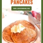 A plate with two pancakes topped with butter, labeled Spiced Pear Pancakes above.