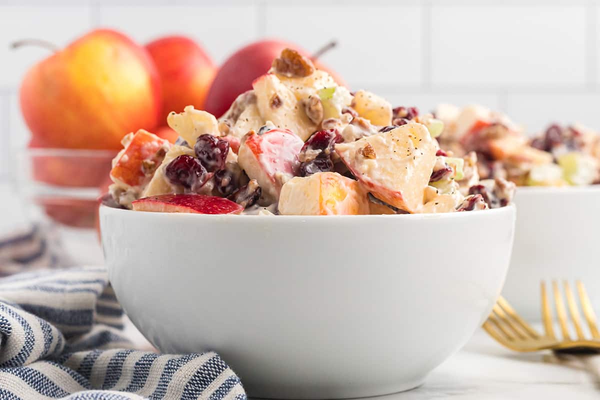 Cranberry Waldorf Salad in a white serving bowl.