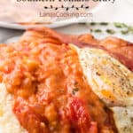 Tomato gravy over biscuits topped with a fried egg.
