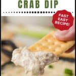 A cracker dipped in creamy crab dip with text: “Hot Baked Crab Dip. Fast Easy Recipe!”.