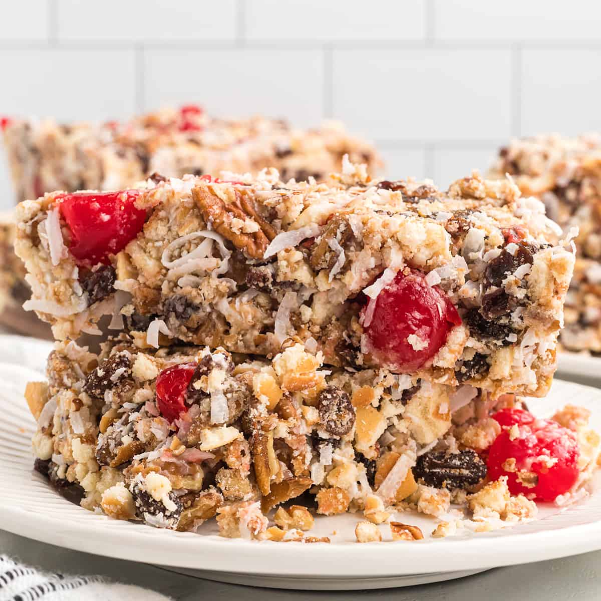 A serving of icebox fruitcake on a white plate.