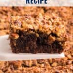 A pecan pie brownie being lifted from a tray, with text Pecan Pie Brownies Recipe and lanascooking.com.
