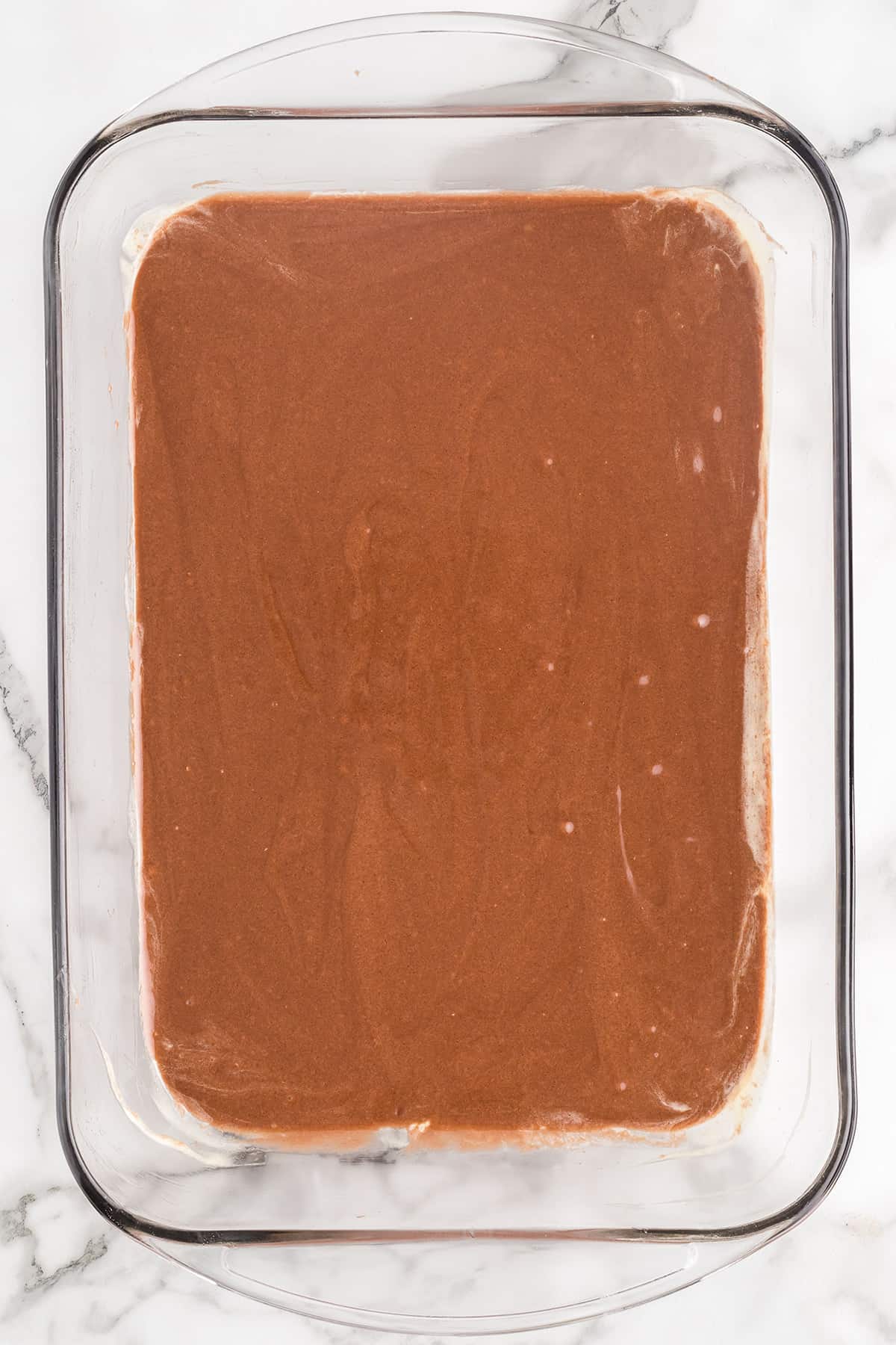 Brownie batter in a baking dish.