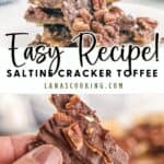 Chocolate-covered saltine cracker toffee topped with pecans, shown in stacked pieces and held in a hand.