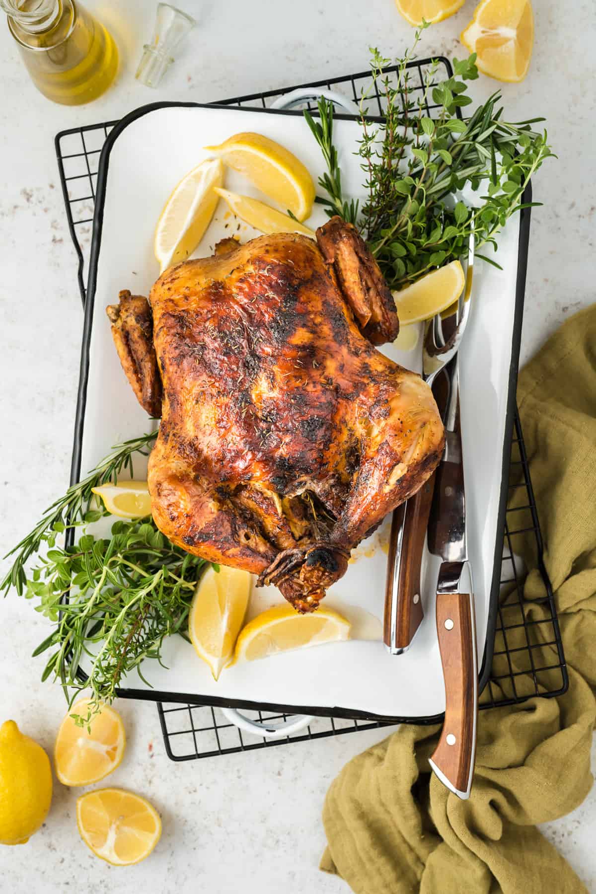 Finished rotisserie chicken on a plate.