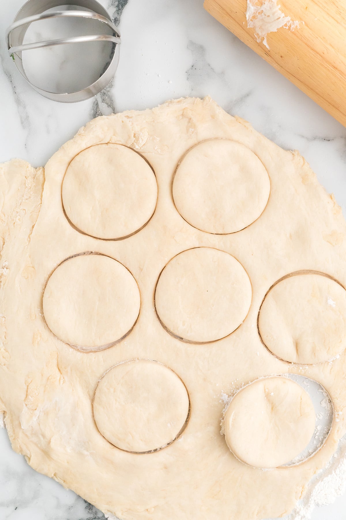 Dough rolled out and cut into circles.