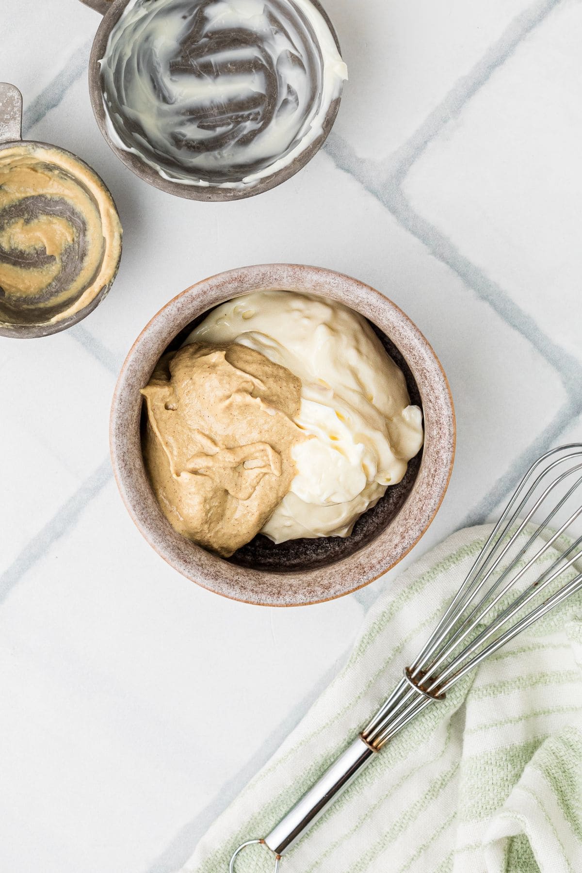 Mayo and Dijon in a small bowl before being mixed together.