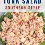 A plate of tuna salad with diced apples and celery served on a bed of lettuce, topped with a label reading Tuna Salad Southern Style and the website lanascooking.com.