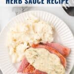 Plate of ham with creamy herb sauce and mashed potatoes on a white dish, fork nearby, text overlay on top.