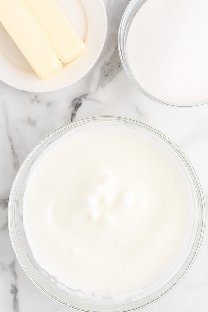 Beaten egg whites in a bowl.