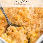 Casserole with a serving spoon dipping into the contents.