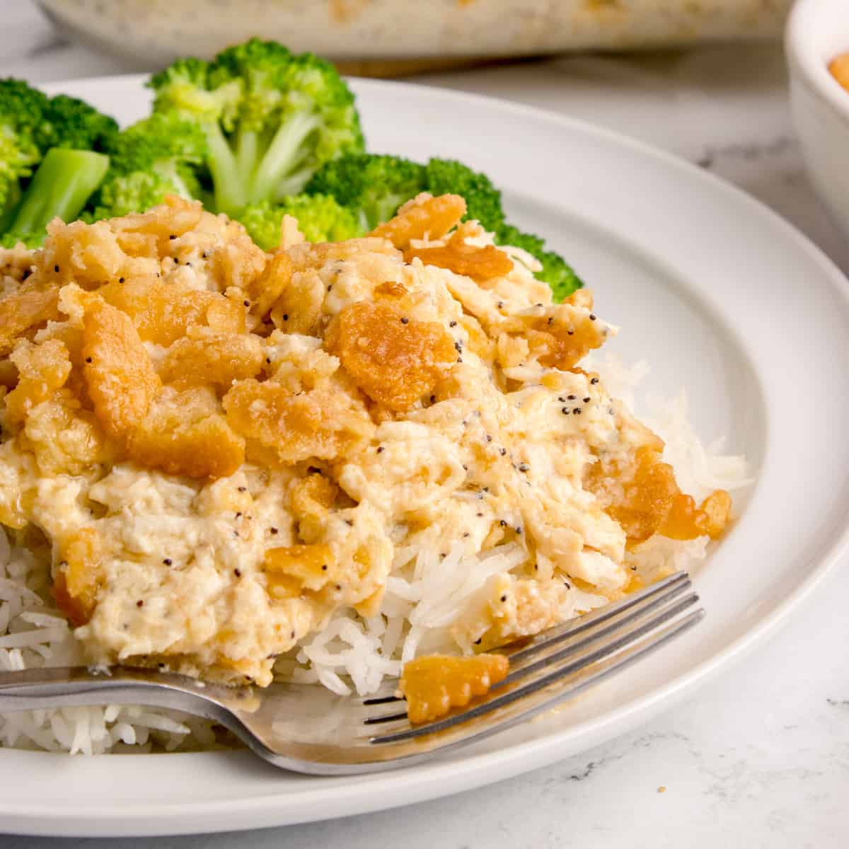 A serving of casserole on a white dish.