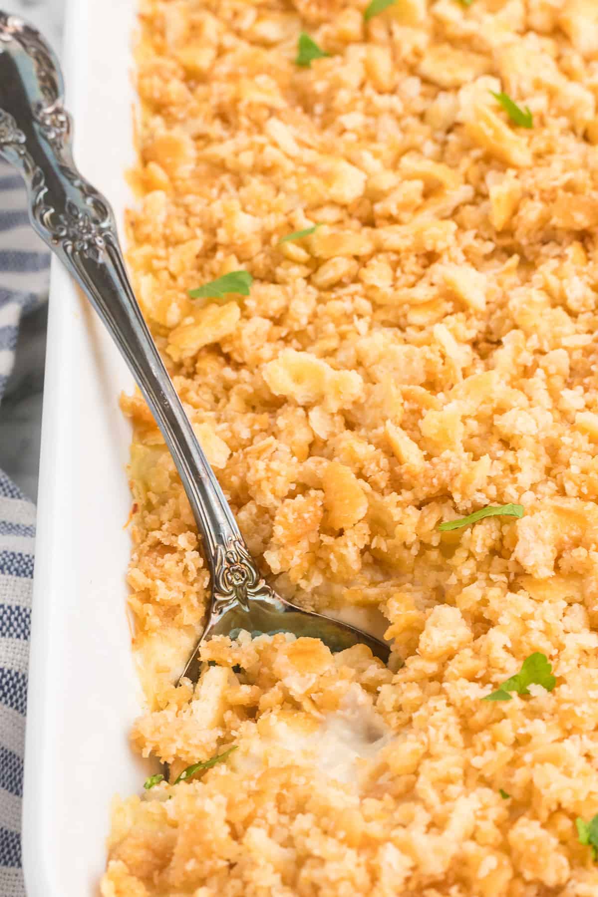 Casserole with a serving spoon in a dish.