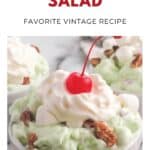 A bowl of green Watergate salad topped with whipped cream, a cherry, pecans, and mini marshmallows.
