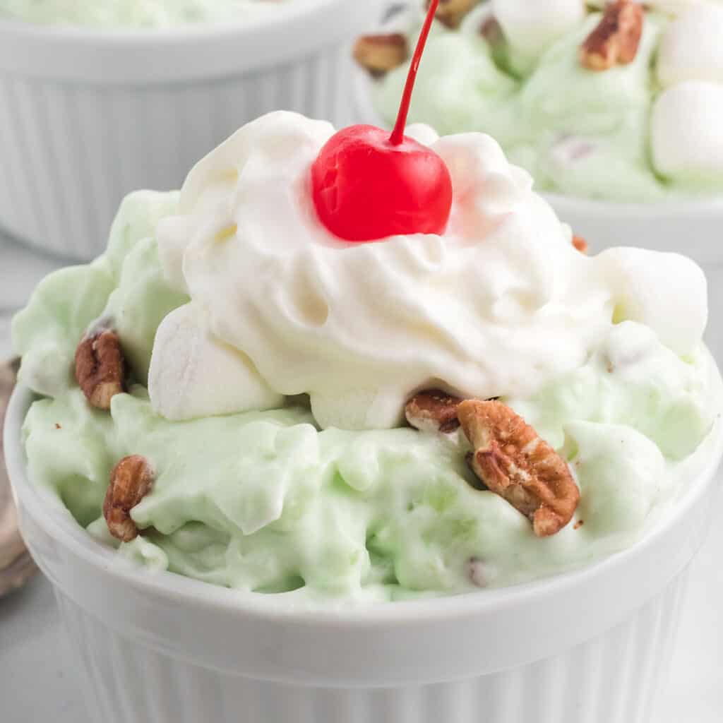 A serving of Watergate Salad in a white ramekin.