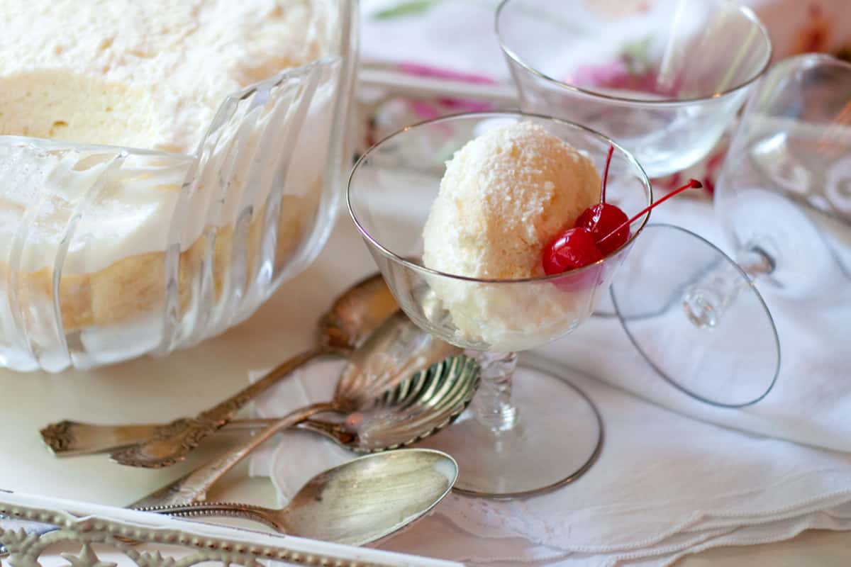 A serving of charlotte russe in a crystal dish.