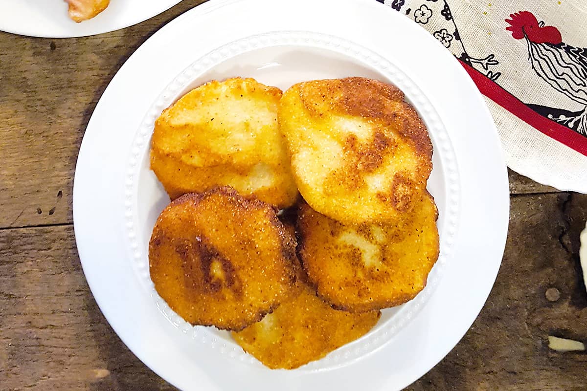 Finished cornbread on a white plate.