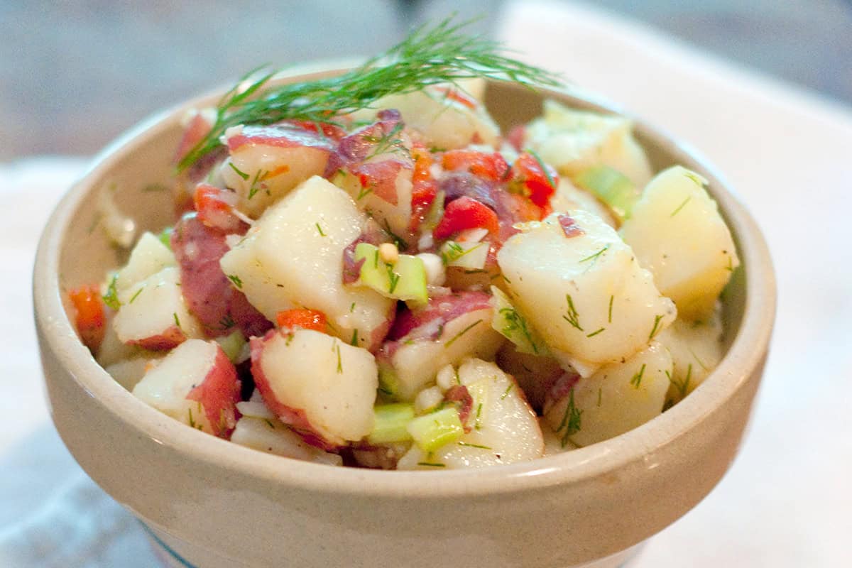 Lemon dill potato salad in a vintage bowl.